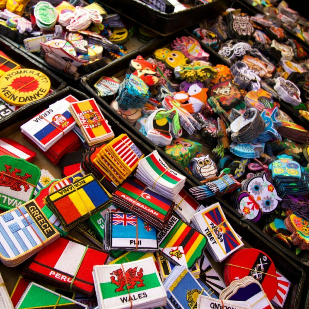 Berlin, Germany: 5 Aug 2018 - Lots of Colourful Embroidered Badge Patches of Flags and Animals at Market Stall