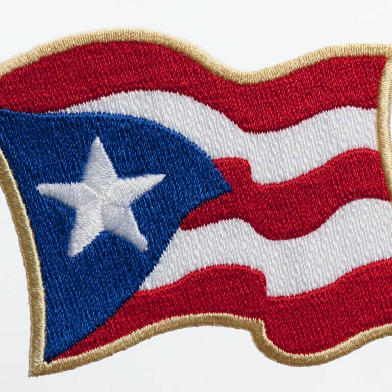 Puerto Rico waving flag patch on white background.